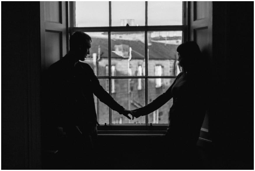 couple look out over edinburgh city 