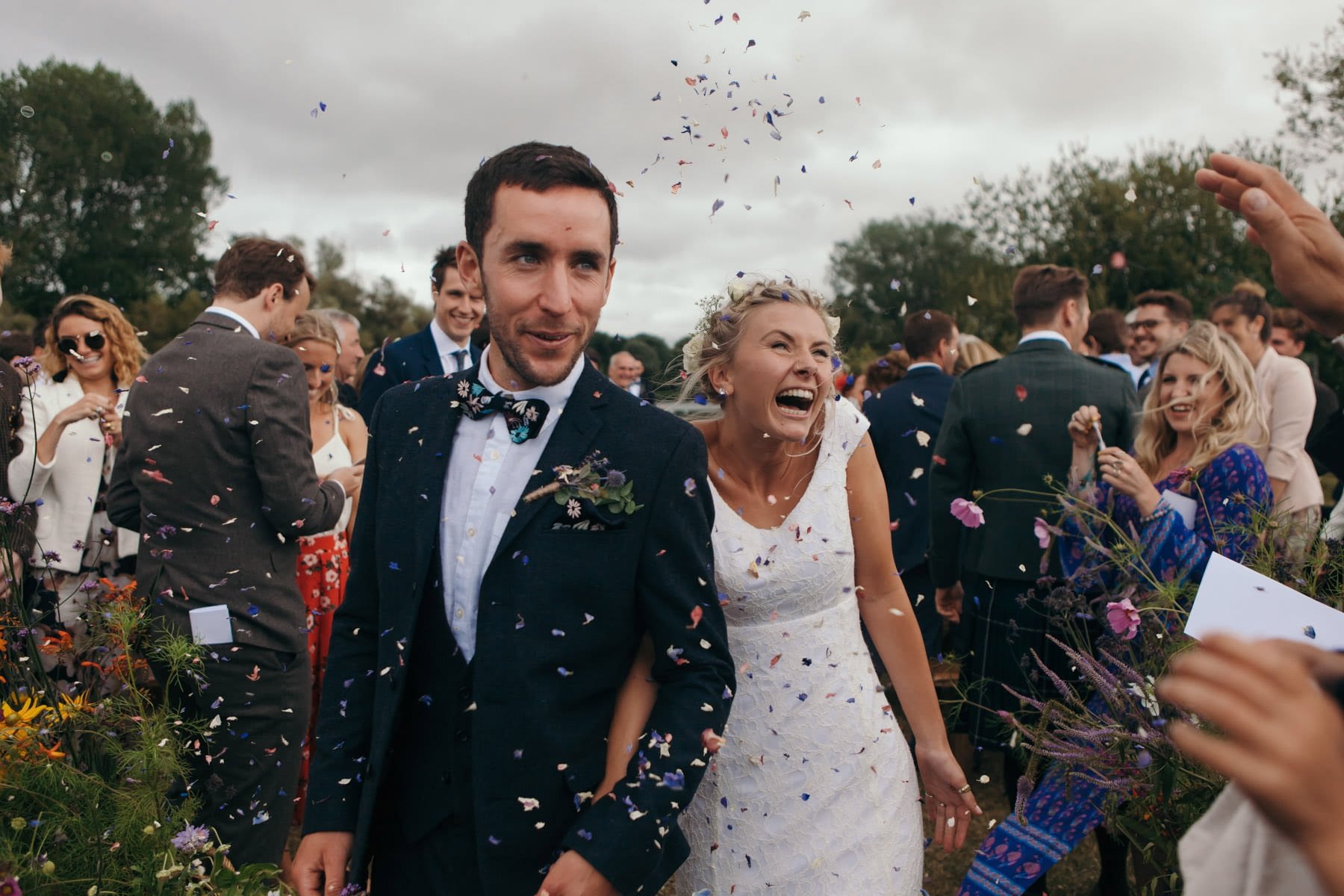 Happy couple celebrate with confetti